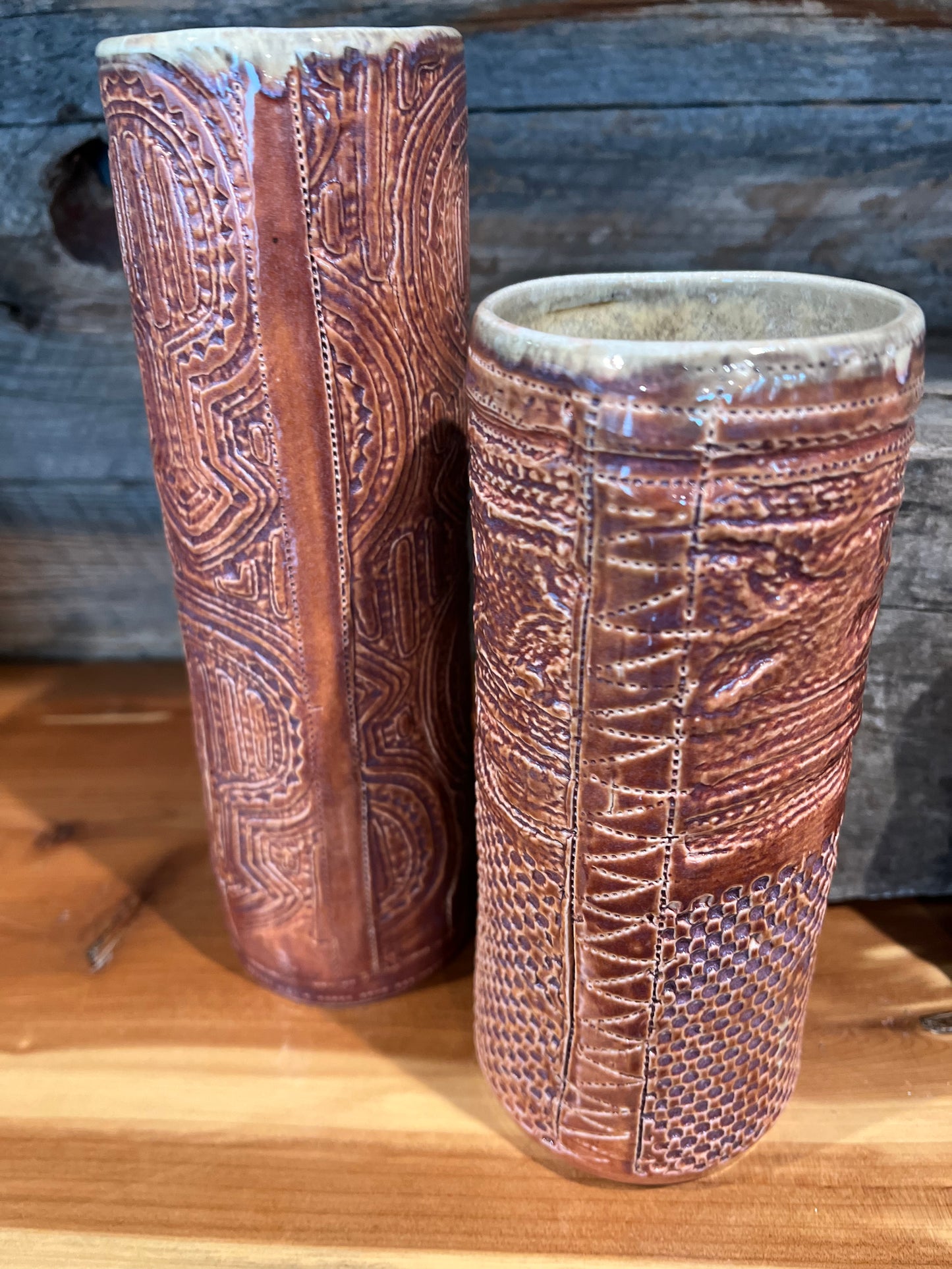 Brown glazed plates, mugs and vases